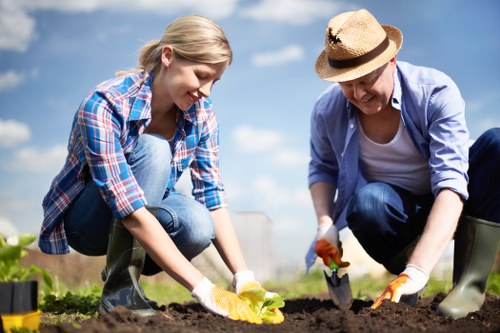 Maintenance crew performing garden care in the middle of a property